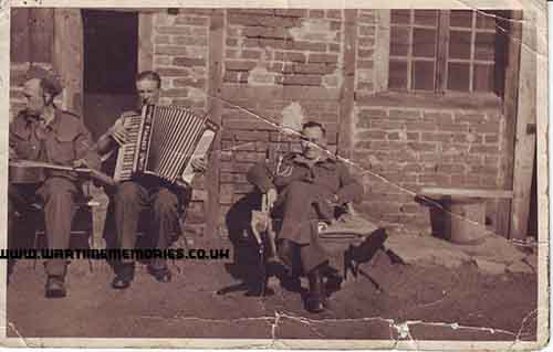 Private John Edward Milne (playing the Accordian)